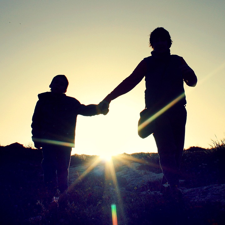 parent and child holding hands, eva carlston academy