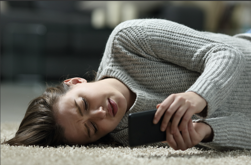 Girl-laying-on-floor-with-phone