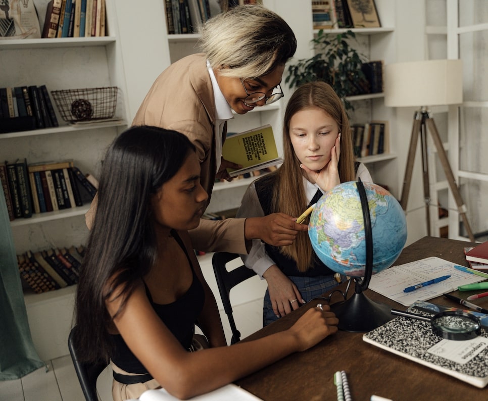 Two teenagers being taught by role model