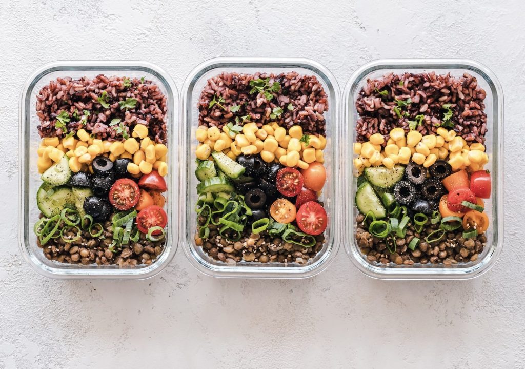 Meal prep containers with salads inside