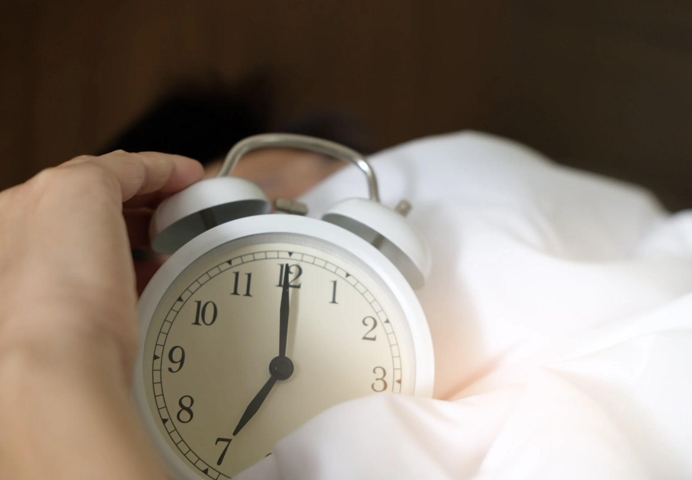 Photo of Alarm Clock in Bed