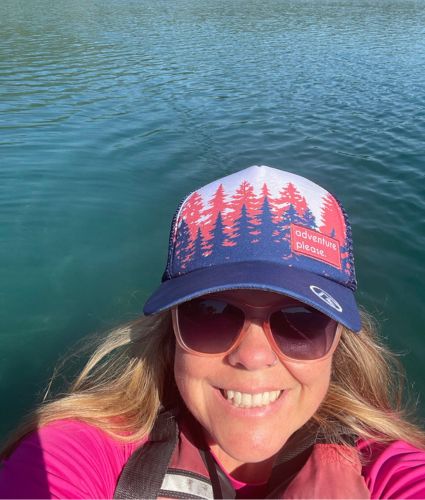 Eva Carlston therapist Monica Matthews smiles with a body of water in the background