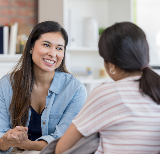 A therapist and a young woman in a supportive counseling session, discussing setting boundaries for emotional growth and building healthy relationships.