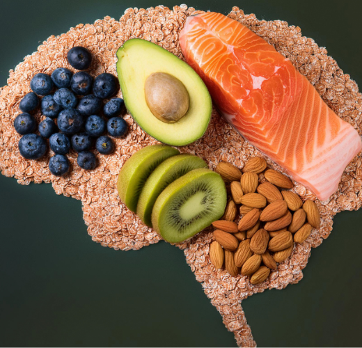 A brain-shaped arrangement of nutritious foods including blueberries, avocado, salmon, almonds, kiwi, and oats, representing the role of nutrition in mental health."