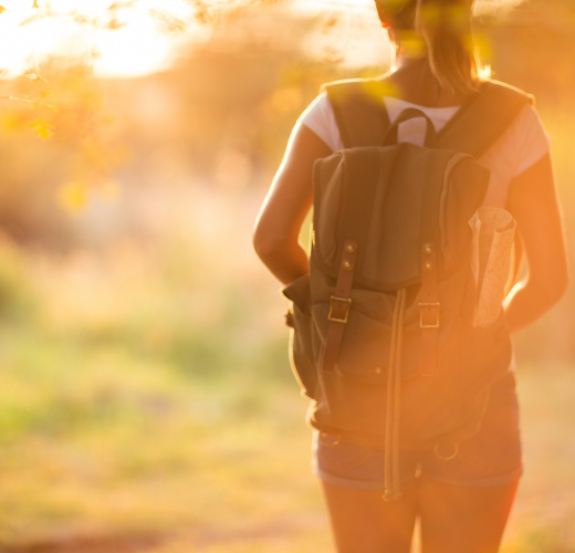 A teen walking into the light, symbolizing personal growth and embracing imperfection in teens during transitions.